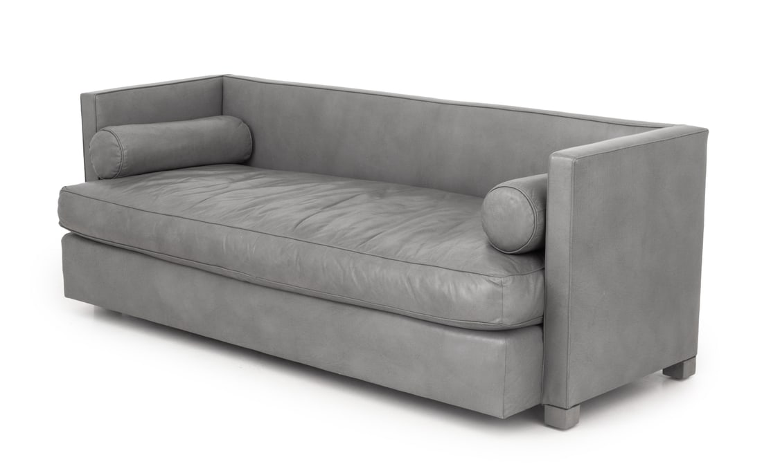 Modern Gray Leather Upholstered 3-Seat Sofa: Modern Gray Leather Upholstered Three-Seat Sofa, with two bolster cushions. 30.5" H x 84" W x 33" D; seat: 19" H. Provenance: From a Park Slope Estate. Keywords: Modern Furniture, Couch, Seating,