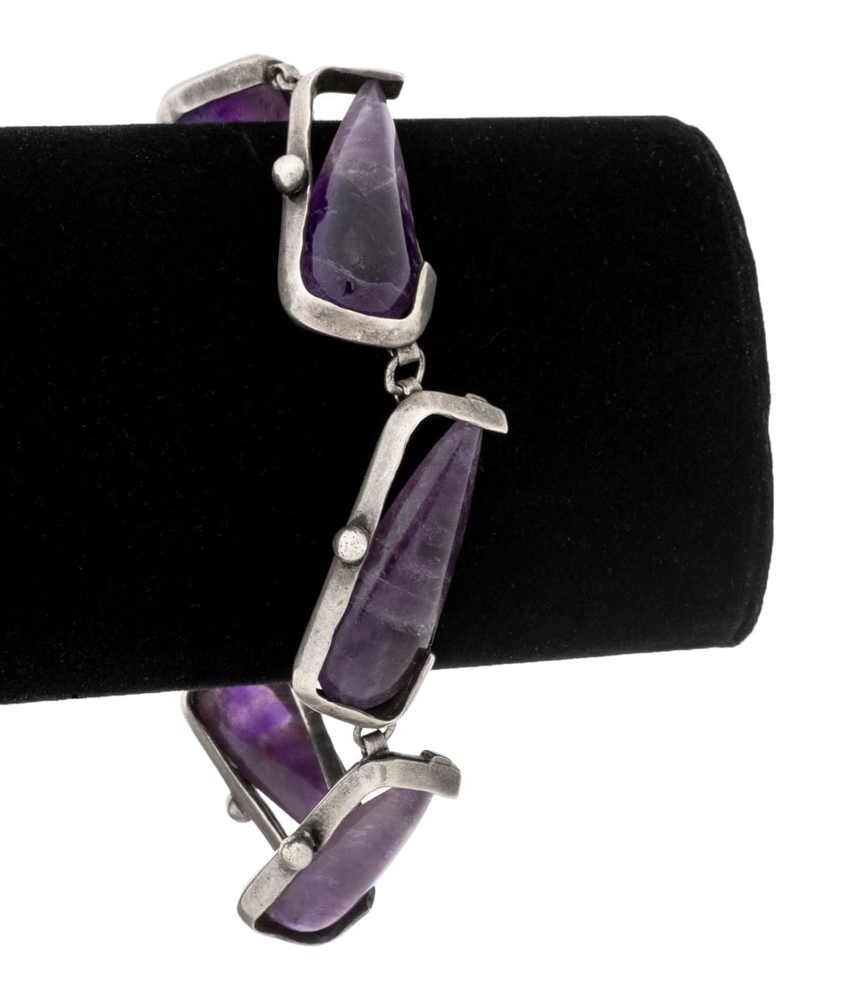 Antonio Pineda Taxco Silver Amethyst Bracelet: Antonio Pineda Taxco 970 Silver Amethyst Bracelet, featuring six channel set pear shaped amethyst cabochons weighing a total of approx. 112 carats, links joined box and tongue clasp and fixed chain
