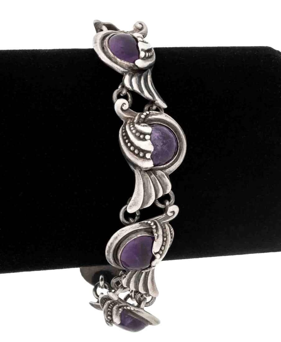 Margot de Taxco Sterling Silver Amethyst Bracelet: Margot de Taxco Sterling Silver Amethyst Bracelet, featuring seven bezel set amethyst cabochons weighing a total of approx. 50.00 carats, joined with box and tongue clasp and fixed chain safety with