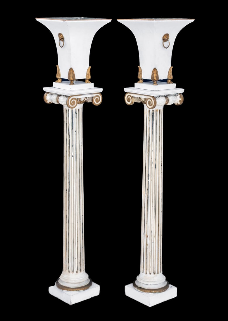 Hollywood Regency Patinated Metal Torchieres, Pair: Pair of Hollywood Regency White Patinated Metal Torchieres, each with lion head ring handles on brass paw feet mounted on mirrored fluted ionic column terminating in square base. 51" H x 11.25" W x