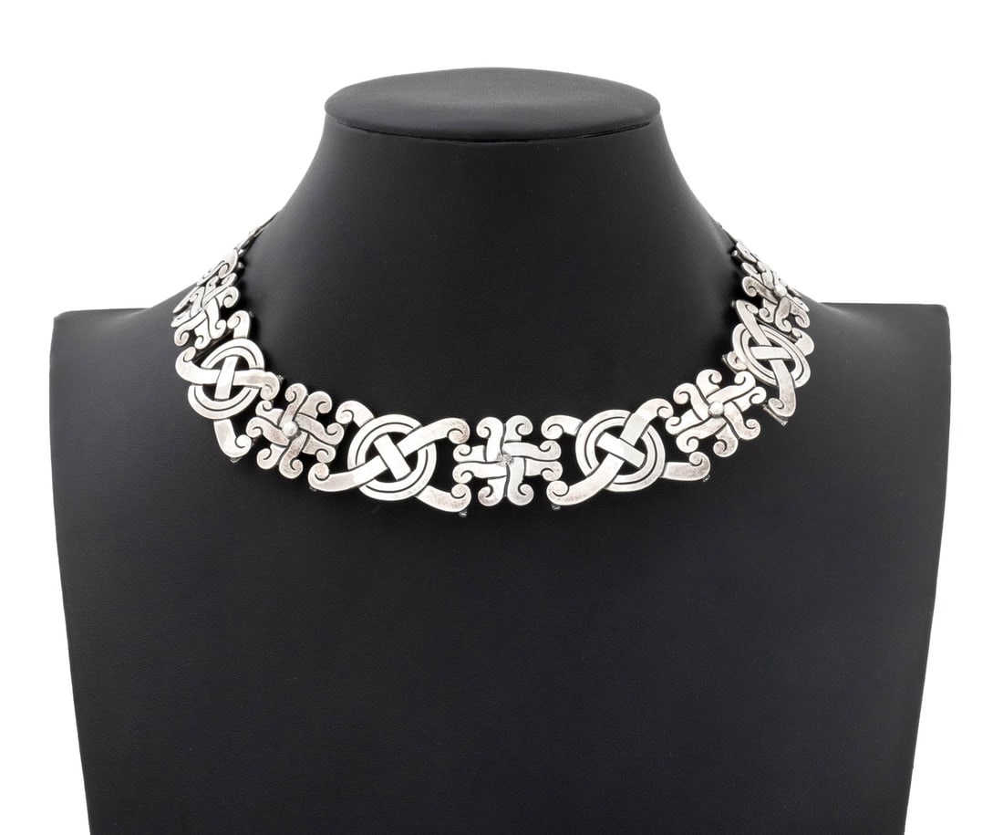 Taxco Sterling Silver Choker Necklace: Taxco Sterling Silver Choker Necklace, designed as"x" and "o" form knots hand-fabricated in silver links decorated with engraving and antiquing, worn over the neck with box and tongue clasp, marked: "