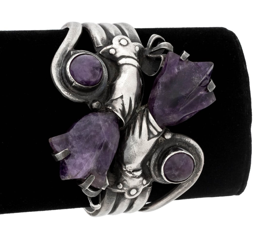 Spratling Attr. Mexican Sterling Amethyst Cuff: William Spratling Attributed Mexican Sterling Silver Amethyst Cuff, designed as two hands holding carved amethyst tulips, further adorned with two bezel set amethyst cabochons, amethyst weighing a tot