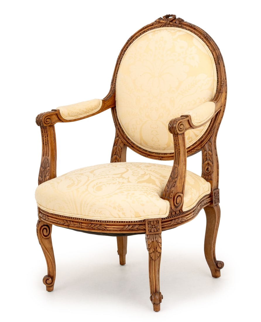 Louis XV Style Wool Damask Upholstered Fauteuil: Louis XV Style Cream Wool Damask Upholstered Walnut Fauteuil, the legs carved with acanthus leaf motif. 39.75" H x 25" W x 24" D; seat: 17.5" H. Provenance: From an East 72nd Street Estate. Keywords: