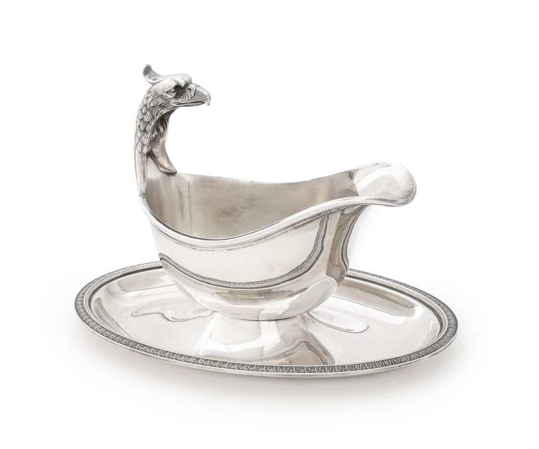 Christofle "Malmaison" Silver Plate Sauce Boat: Christofle "Malmaison" Pattern Silver Plate Sauce Boat, 1935-1983, with eagle head handle and attached oval underplate, marked to underside. 6" H x 8.75" W x 5.5" D. Provenance: From an East 53rd