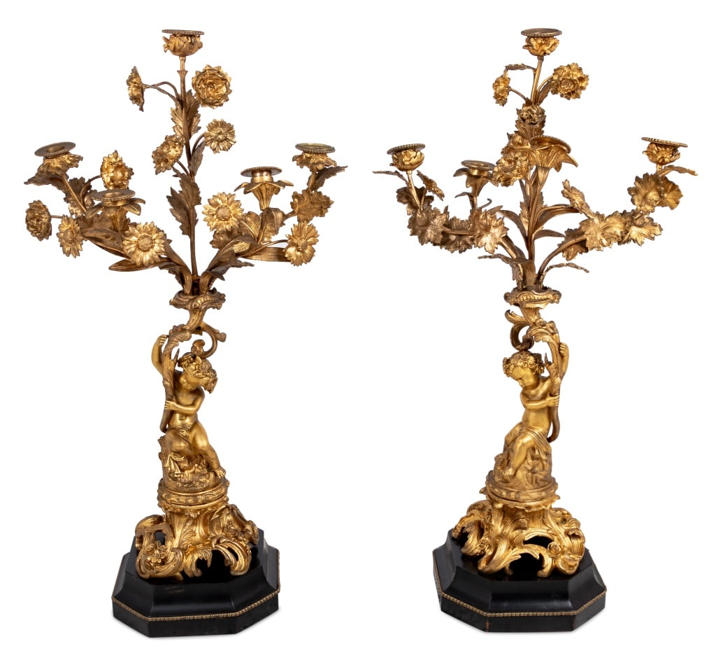 Louis XV Style Gilt Bronze Putti Candelabra, Pr.: Pair of Louis XV Style Gilt Bronze Putti Motif Six Branch Candelabras, late 19th century, each with a seated cherub supporting foliate branches, mounted on acanthus scrolled base and octagonal shaped
