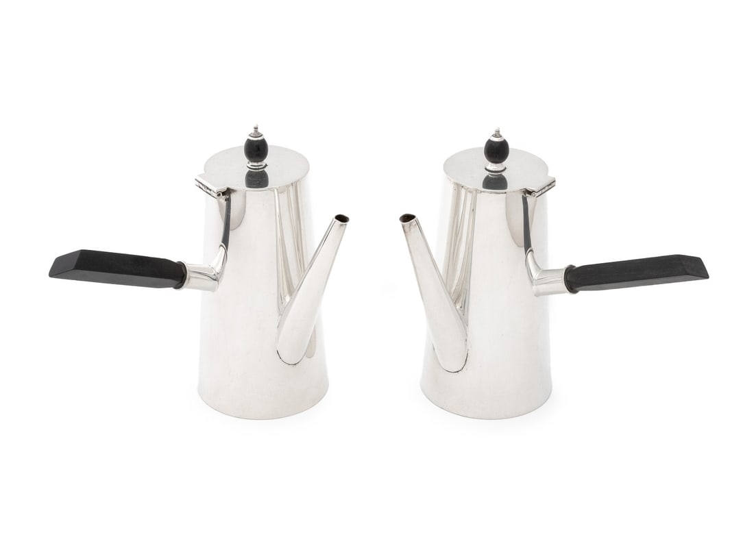 Asprey & Co. Silver Plate Hot Chocolate Pots, Pair: Pair of Asprey and Company Silver Plate Hot Chocolate Pots, each with ebonized wood handle and top handle, marked "A & Co / Asprey / London / 6350 / 8" to underside. 6.75" H x 7" W x 5.25" D. Provenan