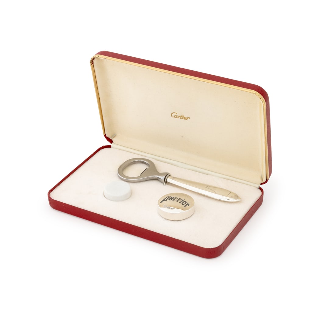 Cartier Perrier Sterling Silver Bottle Opener Set: Cartier Perrier Sterling Silver Bottle Opener Set, with one bottle opener marked "Cartier / Sterling" to handle and one bottle cap marked "Stering / Perrier / Cartier", with original red box. Box: 4.5