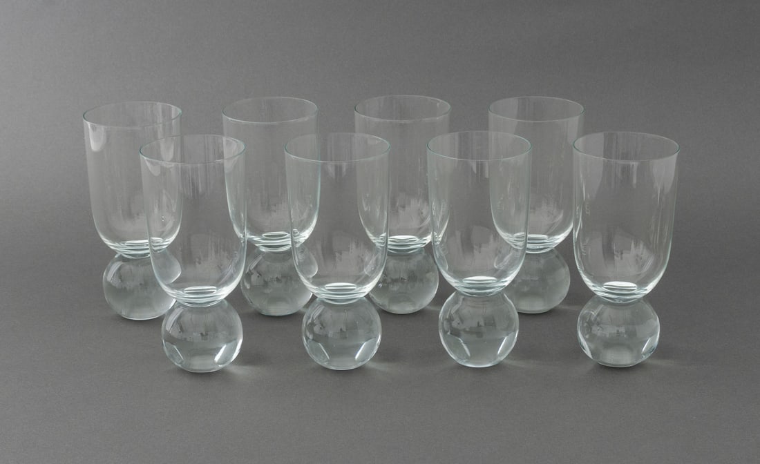 Modern Ball Footed Glass Drinking Cups, 8: Set of Eight Modern Ball Footed Glass Drinking Cups, unmarked. 7.25" H x 3.5" Diameter. Provenance: Property from a Bunny Williams decorated 5th Avenue Estate. Keywords: Handblown glass, Drinkware, Ba