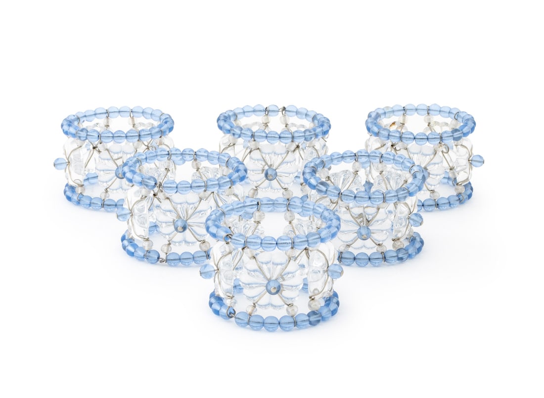 Italian Clair de Lune Blue Glass Napkin Rings, 6: Set of Six Italian Clair de Lune Blue and Colorless Glass Napkin Rings, with rosettes. 1.5" H x 2.5" Diameter. Provenance: From a 955 Fifth Avenue Apartment. Keywords: Art Glass, Tableware, Fine dinin