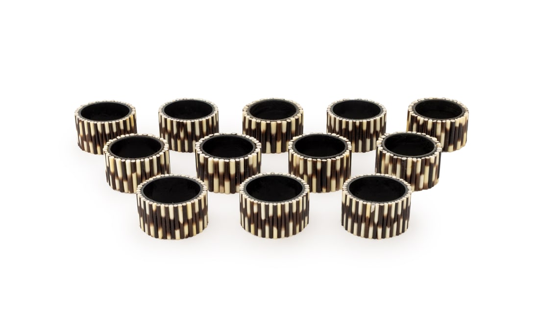 Porcupine Quill Napkin Rings, 12: Set of 12 Porcupine Quill Napkin Rings. 1.25" H x 2.25" diameter. Provenance: Property from a Bunny Williams decorated 5th Avenue Estate. Keywords: Objets de Vertu, Place setting, Tableware, Hosting,