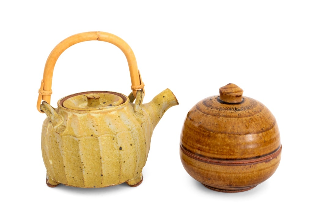 Warren MacKenzie Stoneware Vessels, 2: Warren MacKenzie (American, 1924-2018) Two Stoneware Vessels, comprising: teapot in matte yellow glaze with faux bamboo handle, impressed mark below handle, and glazed covered globular bowl with