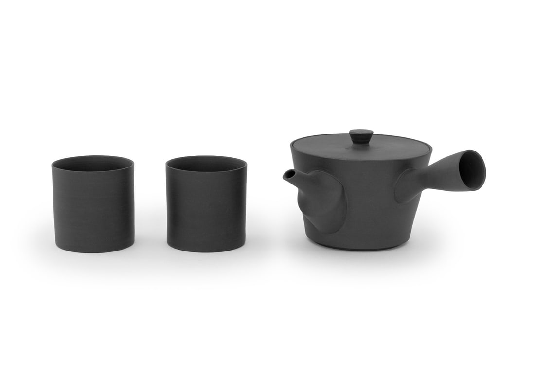 Nenkei Pottery Japanese Sencha Tea Service, 3 Pcs.: Nenkei Pottery Japanese Sencha Black Pottery Tete-a-Tete Tea Service, two cylindrical cups and teapot with built-in tea strainer and impressed mark to underside of lid. Teapot: 3.75" H x 7.5" W x