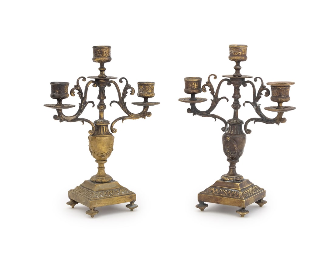 French Brass Three-Branch Candelabra, Pair: Pair of French Brass Three-Branch Candelabra, late 19th century, urn form with scrolling branches. 10.25" H x 7.75" W x 3.5" D. Provenance: An East 35th Street Estate. Keywords: Lighting, Neoclassical