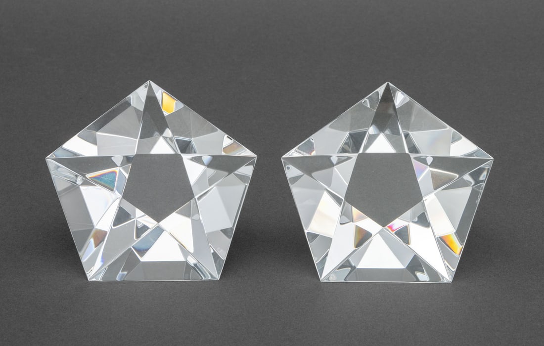 Steuben Crystal Prism Form Paperweights, Pair: Pair of Steuben Crystal Prism Form Paperweights, signed "Steuben" to the base. 2.5" H x 4" W x 4" D. Provenance: From a Long Island Estate. Keywords: American glass, Glassware, Paper holder, Desk acce
