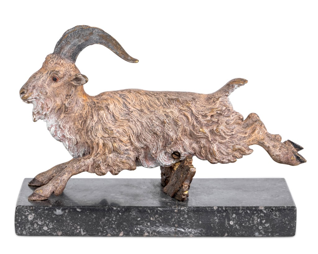 Austrian Cold Painted Bronze Billy Goat: Austrian Cold Painted Bronze Model of a Billy Goat, early 20th century, realistically modeled and articulated jumping a stile on a black marble base. 5" H x 5.5" W x 6" D. Keywords: Austrian Bronzes,