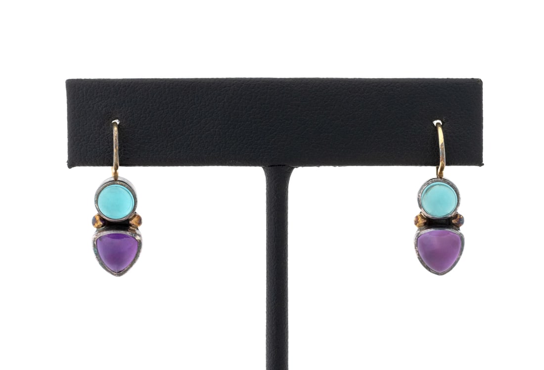 925 18K 22K Gold Amethyst Aquamarine Earrings: Pair of Sterling Silver, 18K Gold, and 22K Yellow Gold Amethyst Aquamarine Earrings, featuring two bezel set triangle cabochon amethysts weighing a total of approx. 2.00 carats, further adorned with