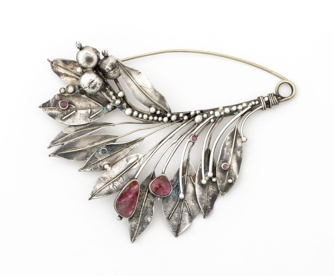 Grigoris Evangelatos Silver Floral Bouquet Brooch: Grigoris Evangelatos Silver Floral Bouquet Brooch, with pink spinel gemstone accents, struck with maker's mark to reverse. Weight: 1.68 ozt.; 4.75" L x 3.5" W. Provenance: From the Collection of Laura