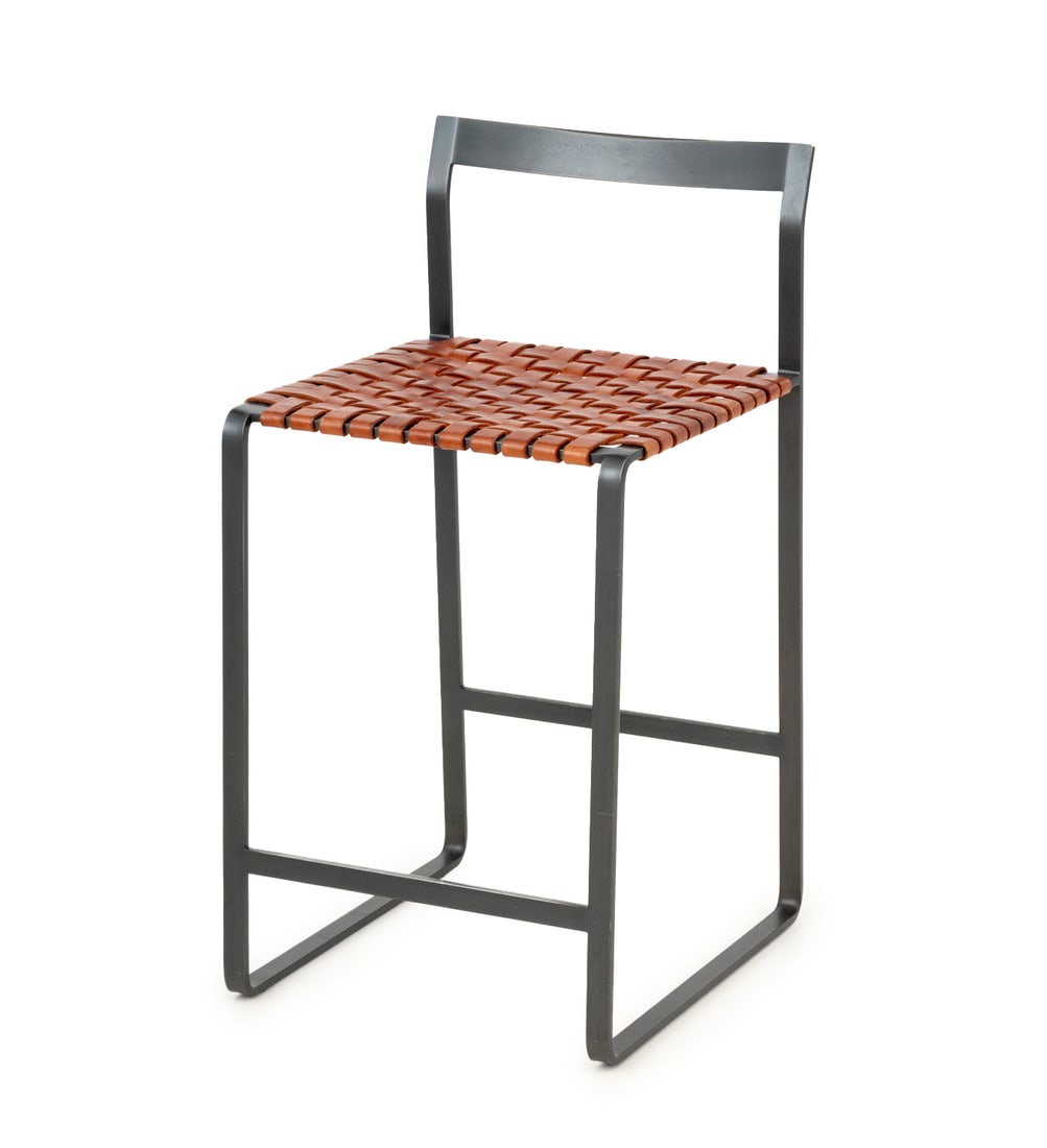 Mark Albrecht Steel and Leather Bar Stool: Mark Albrecht Steel and Leather Bar Stool, woven tan leather seat on four supports conjoined by front stretcher. 33" H x 17" W x 17.5" D. Provenance: A 60 Riverside Drive, Manhattan Penthouse. Keyword