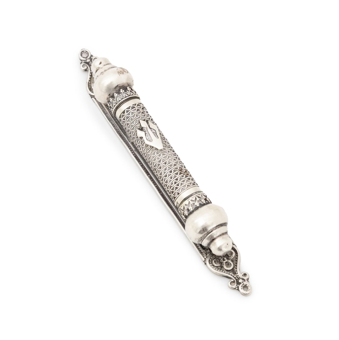 Judaica Silver Mezuzah: Judaica Silver Mezuzah, with pierced decoration and scroll form back plate, unmarked. Silver tested. Weight: 1.36 ozt.; 4.75" L x 0.75" W x 1" D. Provenance: From a 70 E 10th Street Collection.