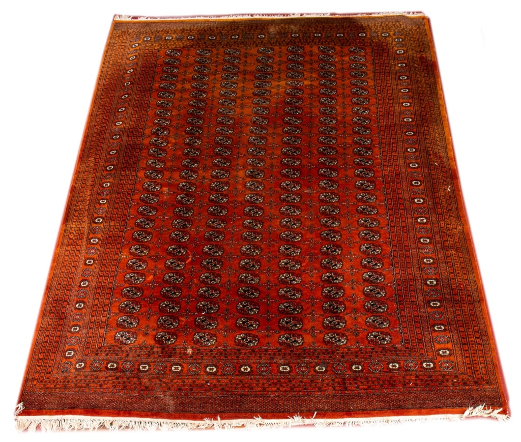 Pakistani Bokhara Carpet, 10' 10" x 8' 4": Pakistani Bokhara Carpet, with geometric medallion design on a red ground, label to underside. 10' 10" L x 8' 4" W. Provenance: From a New York City Collection. Keywords: Area Rug, Floor covering,