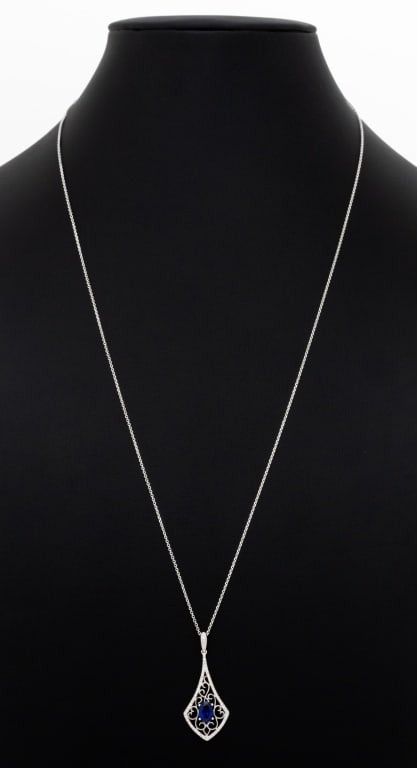 14K White Gold Sapphire and Diamond Necklace: 14K White Gold Sapphire and Diamond Necklace, featuring one centered prong set oval brilliant cut blue sapphire weighing approx. 1.00 carat, further adorned with fifty-six pave set round brilliant cut