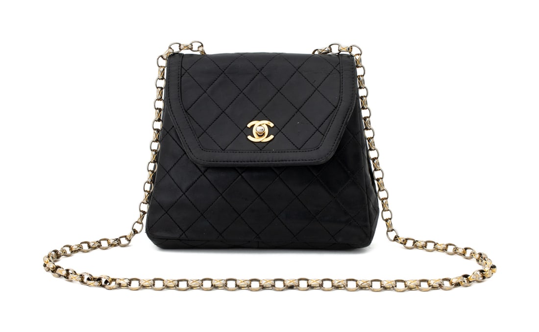 Chanel Quilted Black Leather Trapeze Shoulder Bag: Chanel Quilted Black Leather Trapeze Shoulder Bag, with gold-tone metal hardware and twist lock, with chain link shoulder strap, with burgundy divided interior and single zipper pocket, marked
