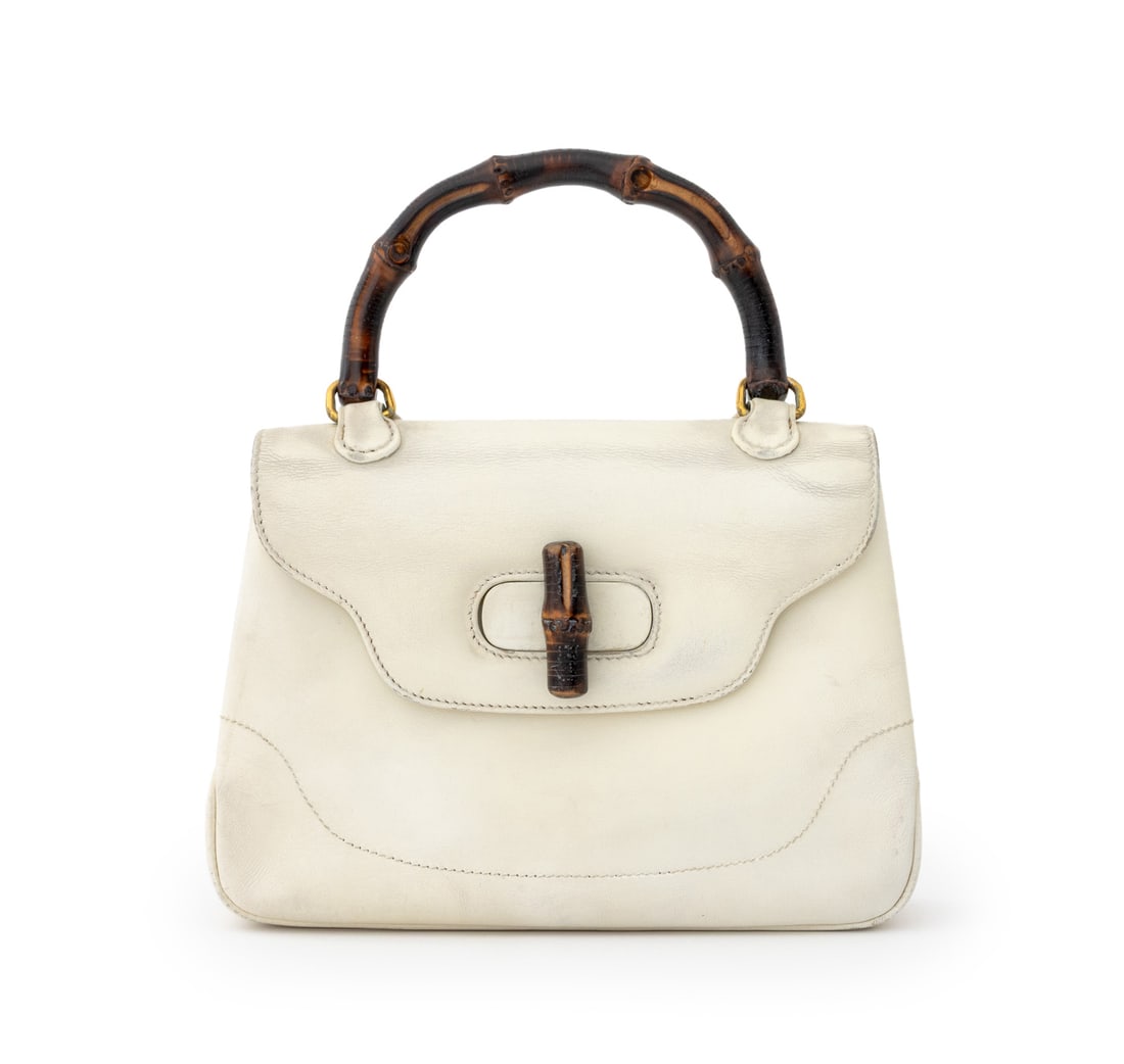 Gucci Bamboo 1947 White Leather Mini Handbag: Gucci Bamboo 1947 White Leather Mini Handbag, with bamboo top handle and locking mechanism, the leather interior with one zipper pocket and two slip pockets, marked "Gucci / Made in Italy". 7.5" H x