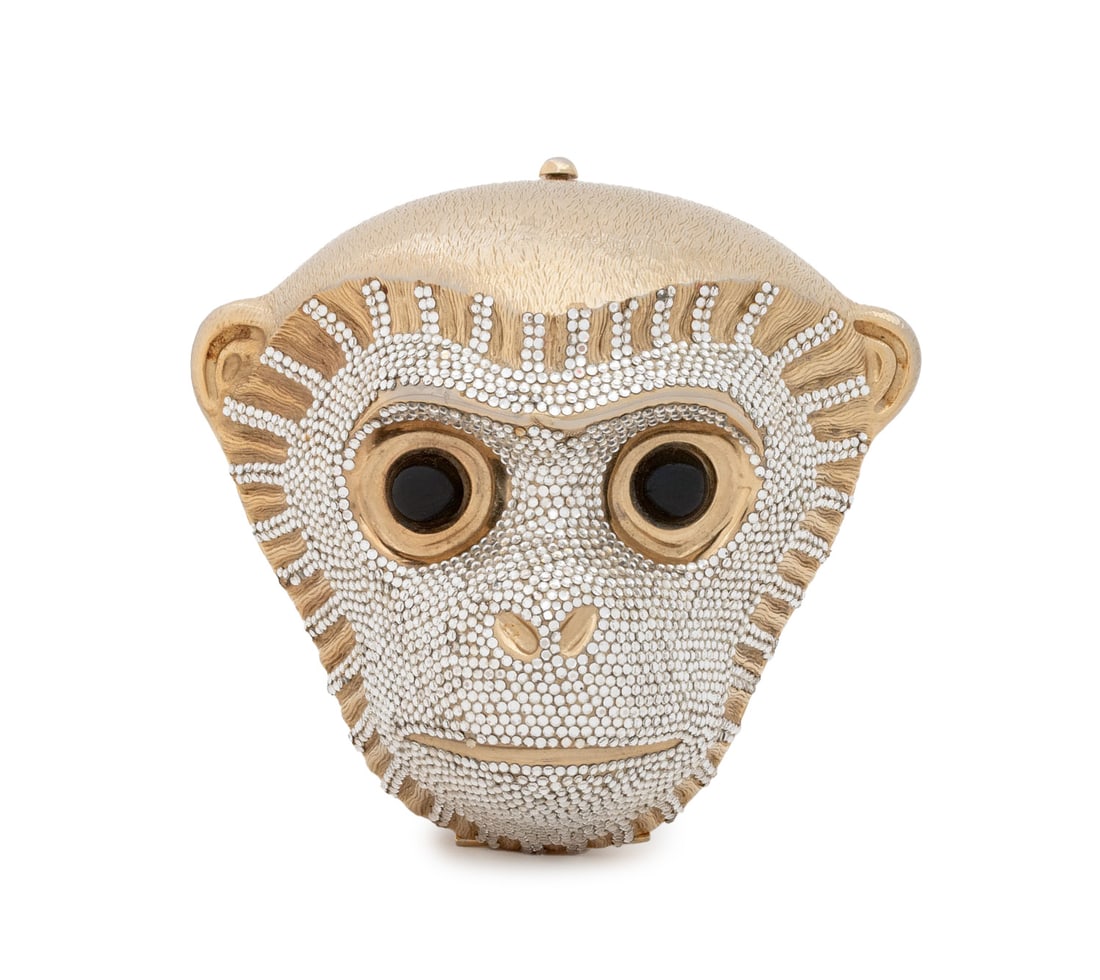 Judith Leiber Swarovski Crystal Monkey Clutch: Judith Leiber Swarovski Crystal Mounted Gold-Tone Metal Monkey Head Form Clutch, with black cabochon eyes and optional shoulder strap, divided interior with two miniature combs, coin purse, and two