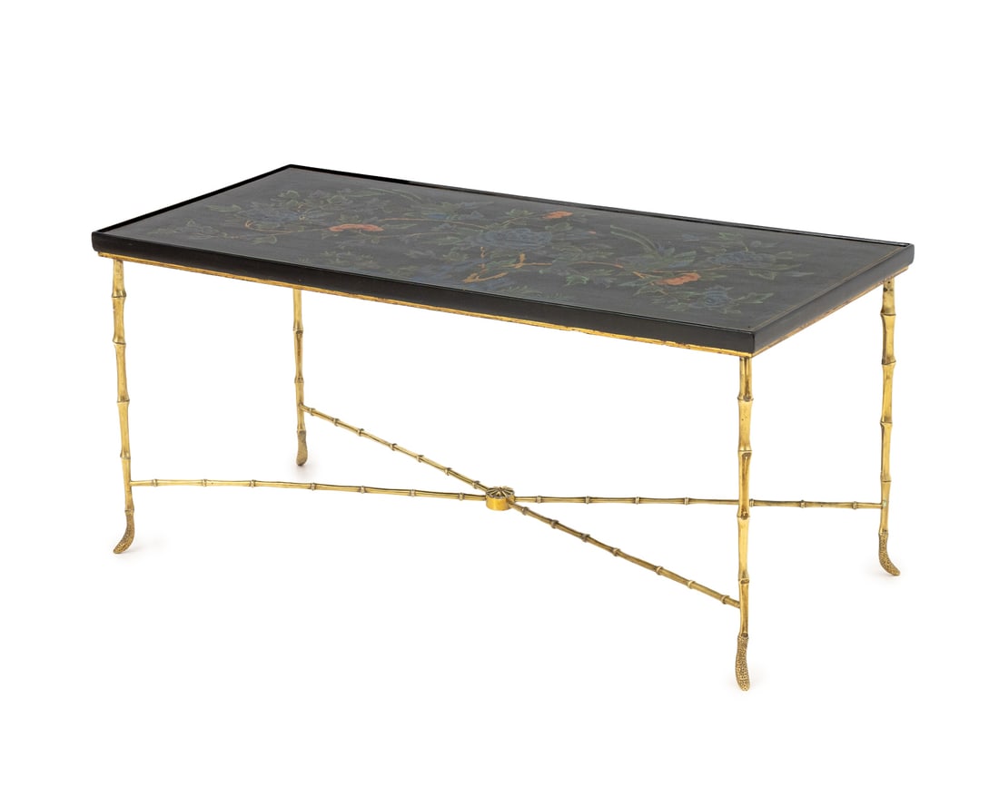 Maison Jansen Style Faux Bamboo Brass Coffee Table: Maison Jansen Style Paint-Decorated Wood Top and Brass Coffee Table, the floral painted rectangular top above iron and brass bamboo form legs conjoined by X-form stretcher. 17.75" H x 38.5" W x 18" D.