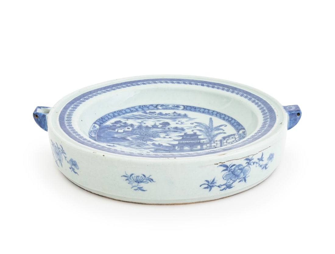 Chinese Export Blue & White Porcelain Heating Dish: Chinese Export Blue and White Porcelain Heating Dish, the interior decorated with a pagoda landscape scene, the exterior with flowers. 2.5" H x 14.25" W x 12.75" D. Provenance: From a New York City
