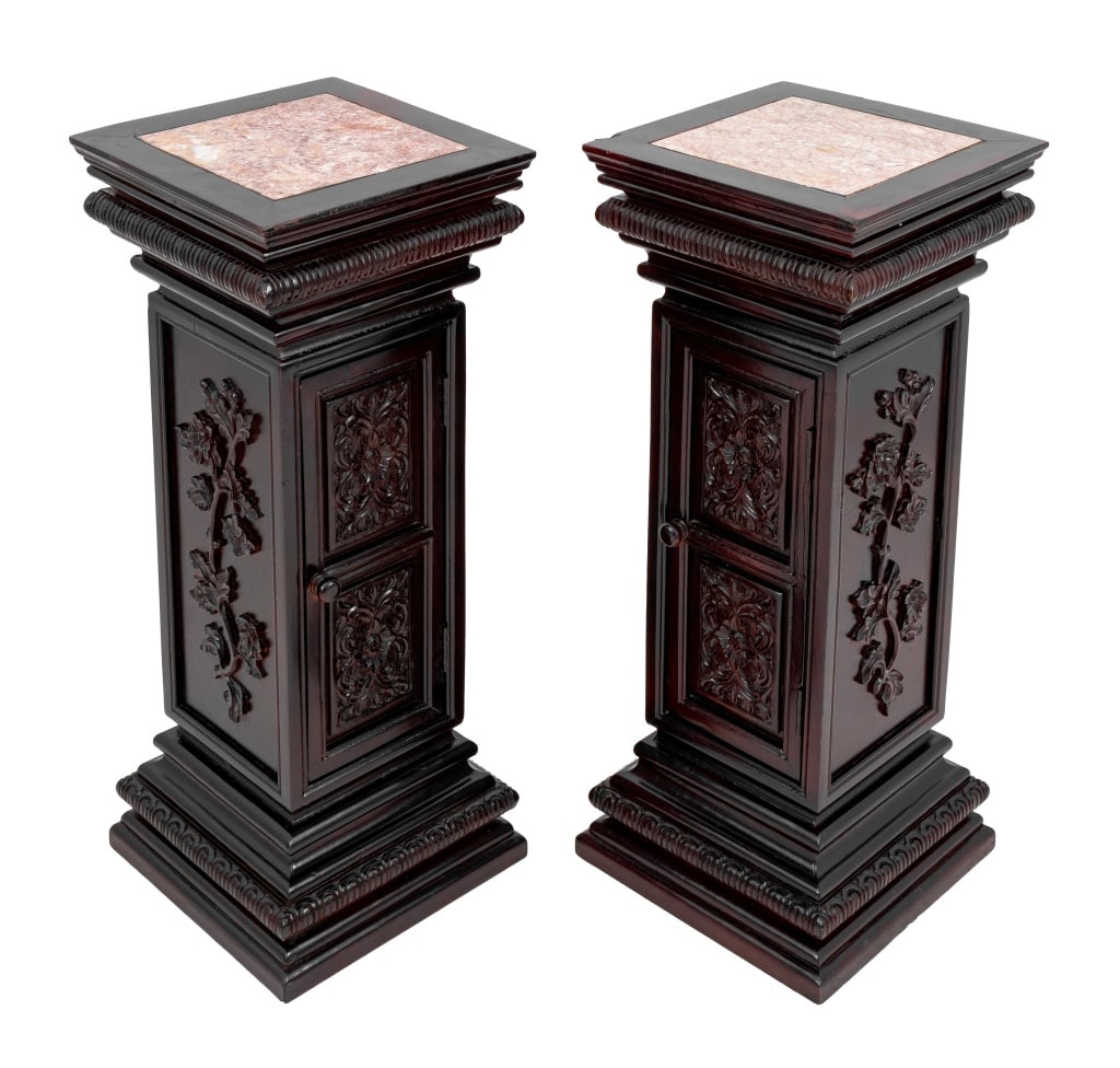 Victorian Style Mahogany & Marble Pedestals, Pair: Pair of Victorian Style Mahogany and Marble Pedestals, 20th century, each with square inset top above a carved column enclosing a cupboard atop a stepped plinth. 32" H x 12.5" W x 12.5" D. Keywords: