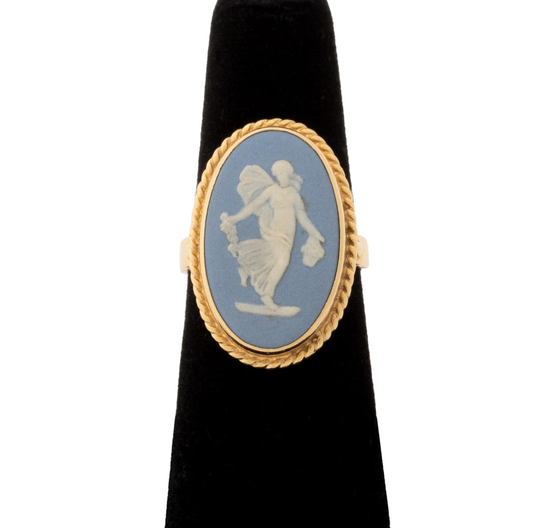 Wedgwood 14K Yellow Gold Cameo Ring: Wedgwood 14K Yellow Gold Cameo Ring, featuring one bezel set carved white on blue jasperware cameo depicting a winged allegorical female figure,approx. 21 x 13 mm, 14K yellow gold surfaces brightly po