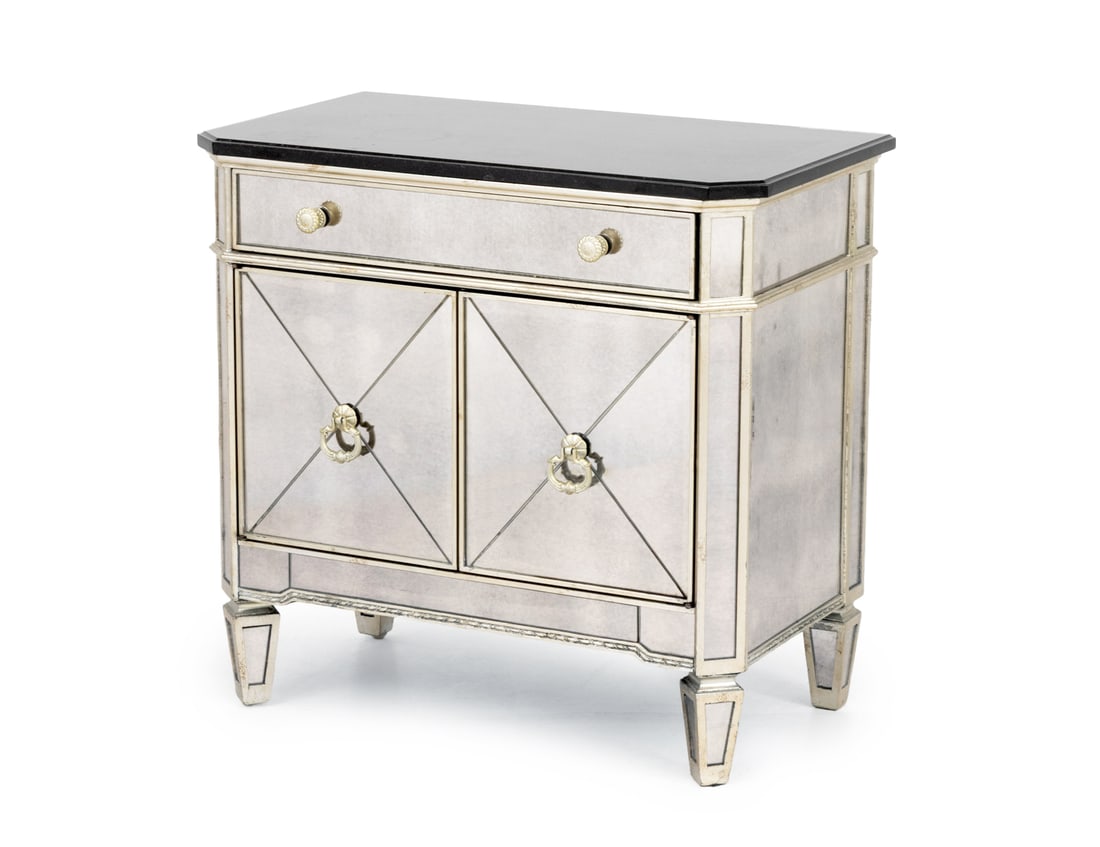 Hollywood Regency Style Mirrored Nightstand: Hollywood Regency Style Mirrored Nightstand, with black marble top above two handled frieze drawer and two-door cabinet opening to two shelves on 29" H x 30.5" W x 17.5" D. Provenance: From an East Vi