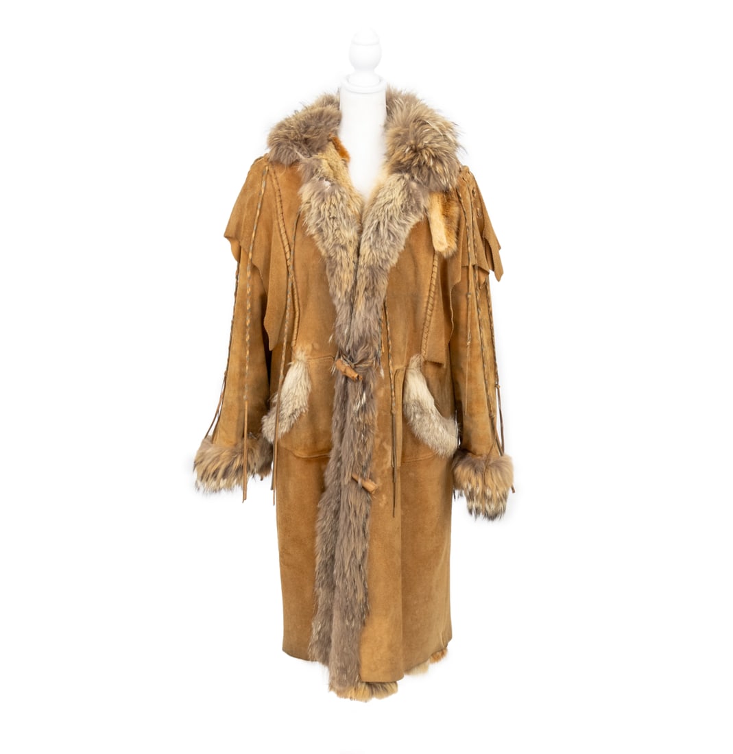 Brown Shearling and Coyote Fur Lined Coat: Brown Shearling and Coyote Fur Lined Coat, with coyote fur collar, trim, and cuffs, front slip pockets with four button loop closures. Overall length: 46"; Shoulders: 21"; Bust: 38"; Sleeve length: 24