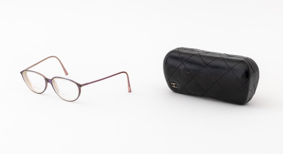 Chanel Iridescent Frame Glasses & Leather Case: Chanel Prescription Trifocal Lens Iridescent Resin Frame Glasses and Quilted Black Leather Case, the glasses marked "Made in Italy", the case mounted with gunmetal-tone CC logo. Case: 6.5" L x 2.25"