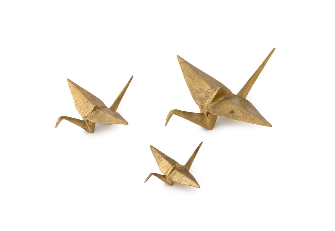 Graduated Brass Origami Swan Sculptures, 3: Set of Three Graduated Brass Origami Swan Sculptures. Largest: 3.5" H x 8.75" W x 9" D. Provenance: From an East Village Estate. Keywords: Statues, Ornaments, Metalwork, Gold-tone, Gilt, Geometric,