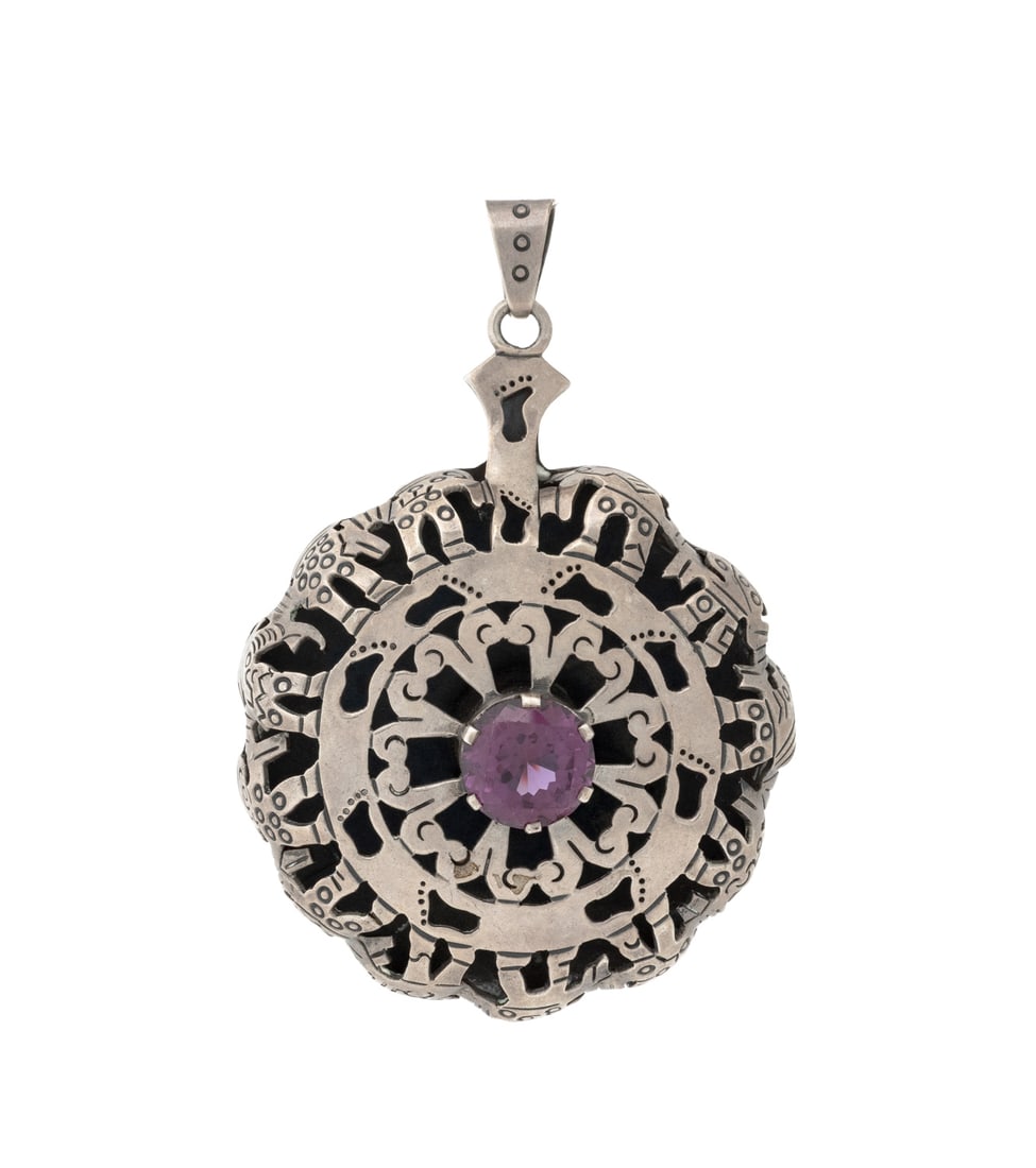 Taxco Sterling Silver Synthetic Sapphire Pendant: Taxco Sterling Silver Synthetic Color Change Sapphire Pendant, featuring one centered prong set round faceted synthetic color change sapphire weighing approx. 14.50 carats, worn as pendant with large