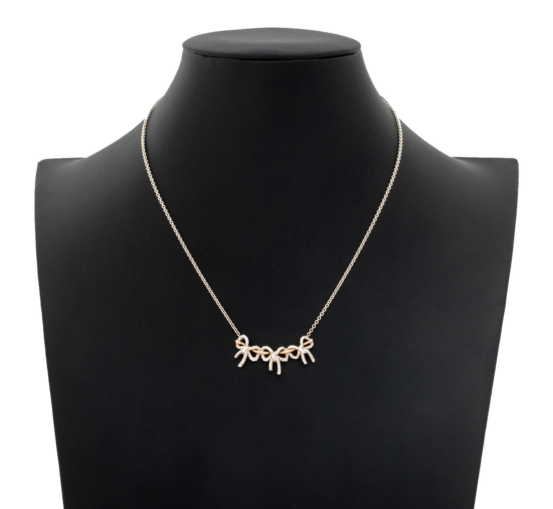 Tiffany & Co. 925 750 Gold Triple Ribbon Necklace: Tiffany and Company Sterling Silver and 18K Yellow Gold Triple Ribbon Necklace, fabricated with three silver twisted wire bows joined by 18K yellow gold single wire, necklace chain segments joined wit