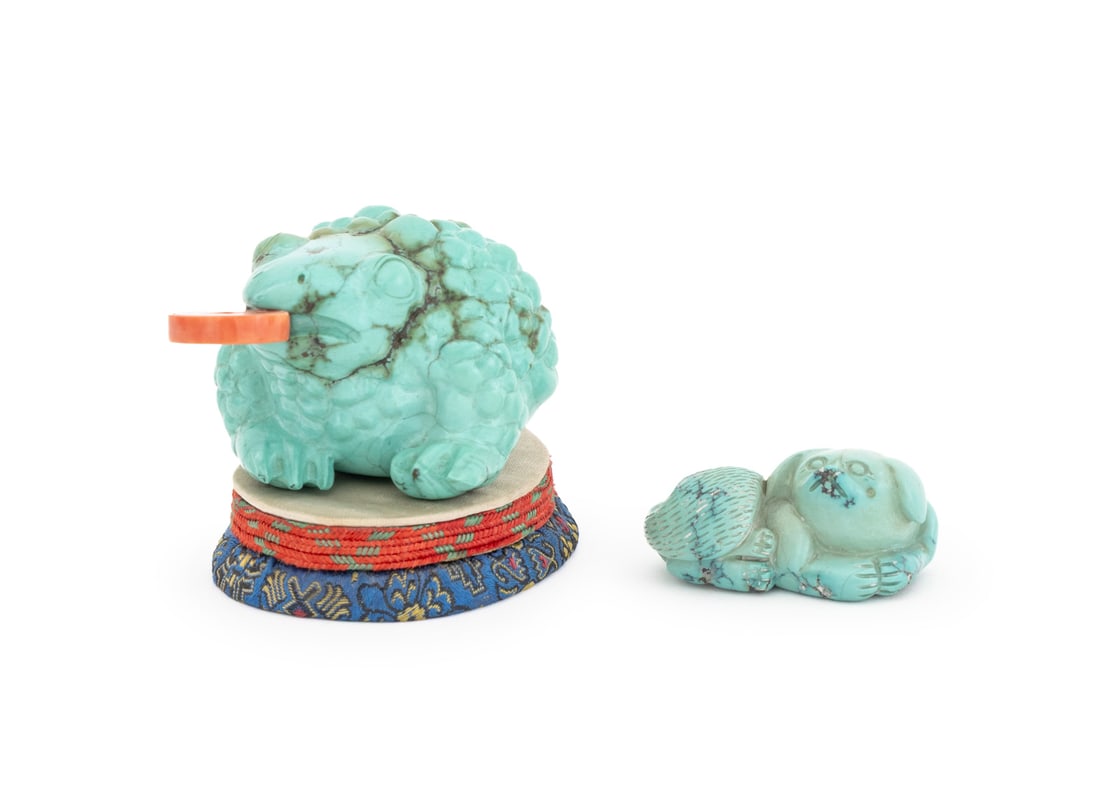 Chinese Carved Turquoise Jin Chan and Dog, 2: Chinese Carved Turquoise Jin Chan and Puppy Sculptures, the three-legged money toad with red coral coin in mouth on textile-covered base, and carving of a reclining dog. Toad: 1.5" H x 2.75" W x 1.75"