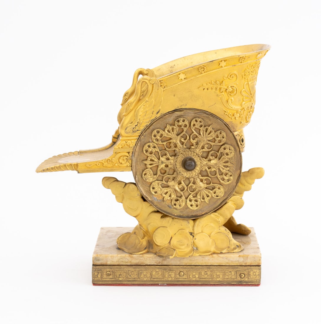 Zeus's Chariot Gilt Metal Sculpture: Zeus's Chariot Gilt Metal Sculpture, with swan form handles and scrolling floral motifs above clouds, mounted on a brown marble base. Overall: 8.5" H x 8.5" W x 4.25" D. Provenance: From a New York Ci