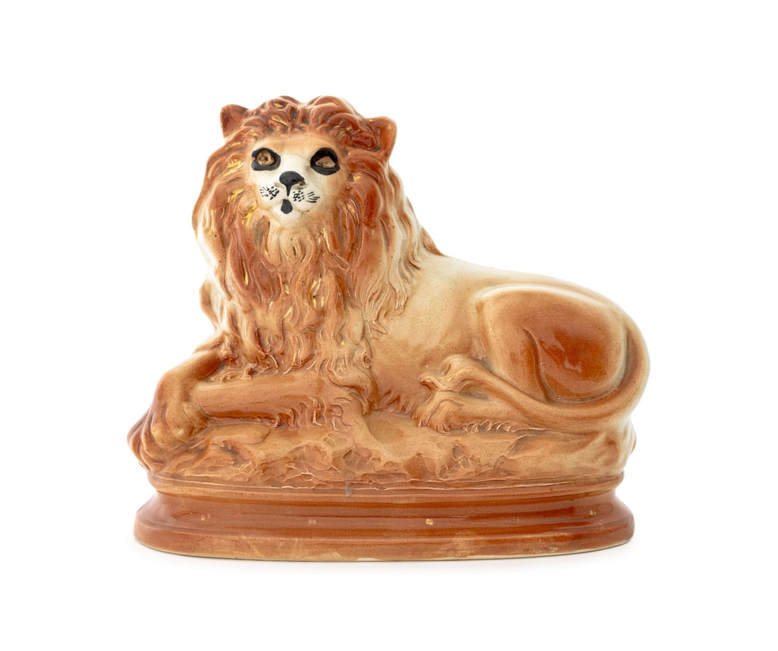 Staffordshire Reclining Lion Sculpture, 19th C.: Staffordshire Hand-Painted Ceramic Reclining Lion Sculpture, 19th century. 10" H x 11.5" W x 5.5" W. Provenance: From an Upper West Side, New York City Estate. Keywords: Statues, Figurines, Mantel scu