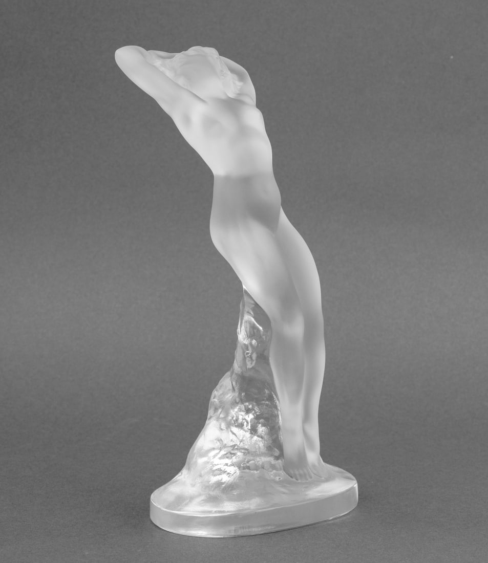 Lalique "Danseuse Bras Leves" Crystal Figurine: Lalique "Danseuse Bras Leves" [Dancer with Raised Arms] Clear and Frosted Crystal Figurine, marked "Lalique France" to underside. 9.25" H x 4.75" W x 3" D. Provenance: From an 135 East 83rd Street Est