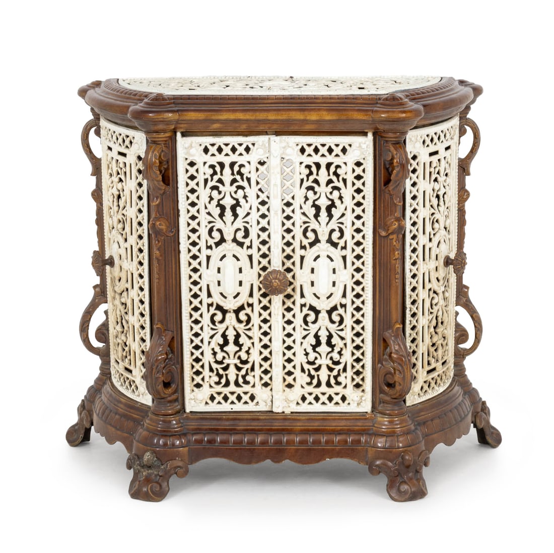 Victorian Cast Iron Radiator Cover: Victorian Cast Iron Radiator Cover, in white and brown with scrolling foliate form doors on four scroll form feet. 35" H x 36" W x 14" D. Provenance: From an Upper West Side, New York City Estate. Key