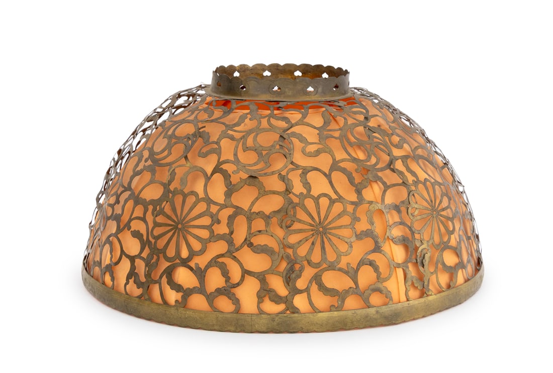 Japanese Brass Openwork Lamp Shade: Japanese Brass Openwork Lamp Shade, with floral motif and orange silk lining. 9.5" H x 18" Diameter. Provenance: From a Manhattan Collector. Keywords: Lighting, Vintage lamps, Chrysanthemum Flowers, P
