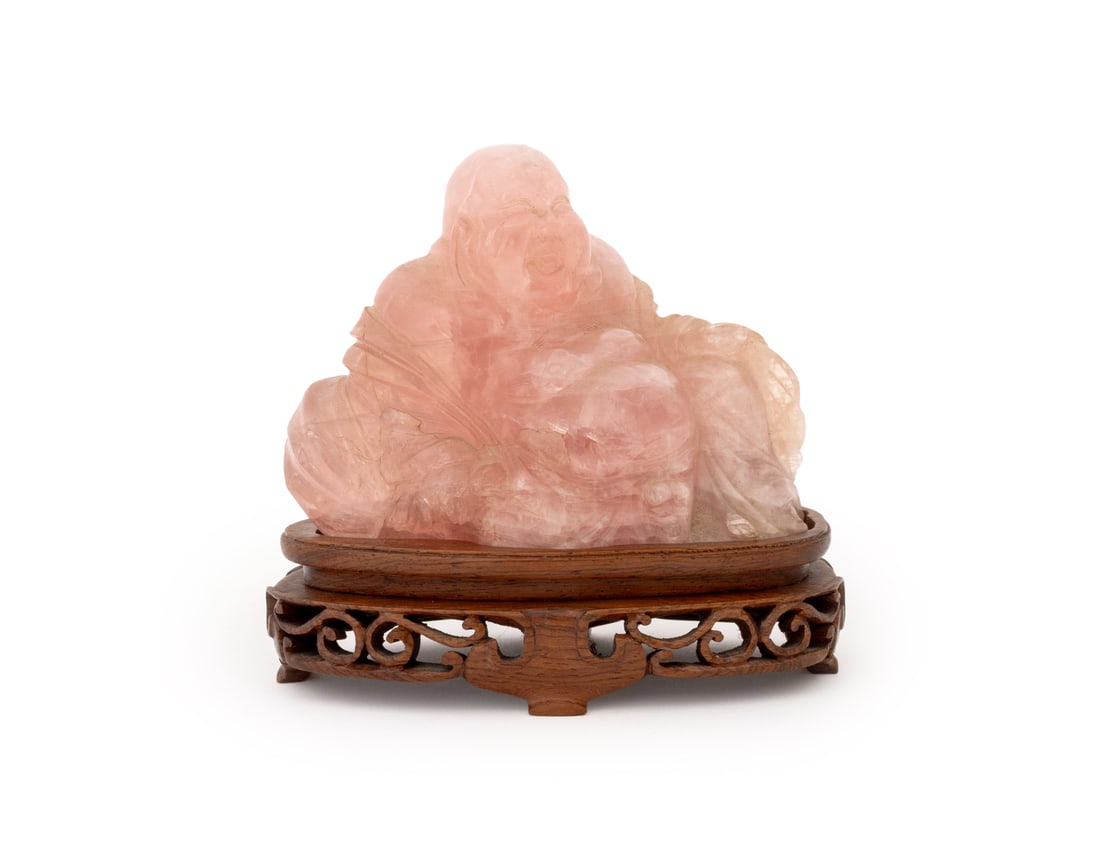Chinese Pink Rock Crystal Seated Buddha Sculpture: Chinese Carved Pink Rock Crystal Seated Buddha Sculpture, with a fitted carved wood stand. Overall: 5" H x 5" W x 3" D. Provenance: From a New York City Estate. Keywords: Asian Art, China, Carving, St