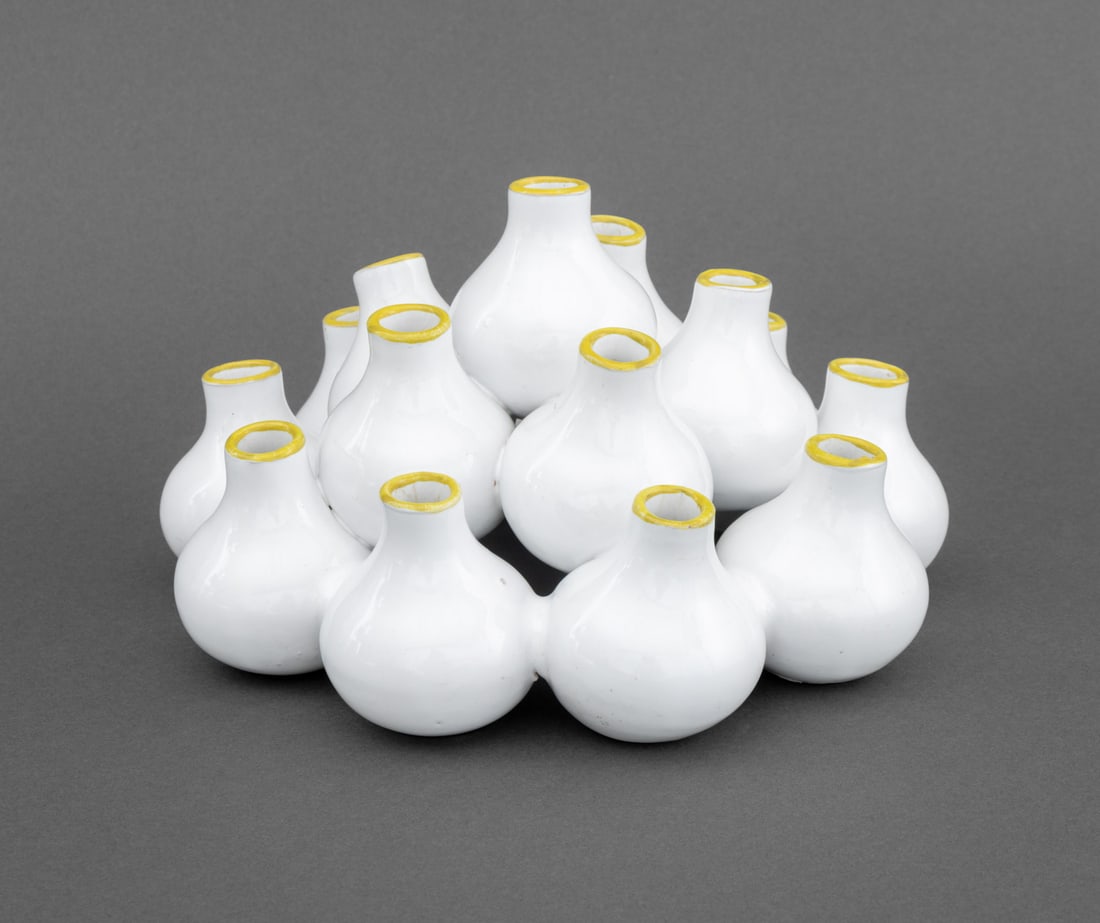 Italian White Glazed Terracotta Vase Grouping: Italian White Glazed Terracotta Vase Grouping, the 15 diminutive vessels with yellow rims. 5.5" H x 9.25" Diameter. Provenance: From an Upper West Side, New York City Estate. Keywords: Ceramics, Art P