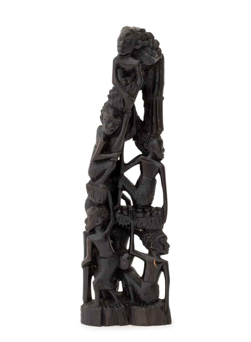 African Makonde Ujamaa Carved Ebony Sculpture: African Makonde "Tree of Life" Ujamaa Carved Ebony Sculpture, hand-carved with reticulated figures. 16.5" H x 5.25" W x 2.75" D. Provenance: From a New York City Estate. Keywords: African Art, Statue,