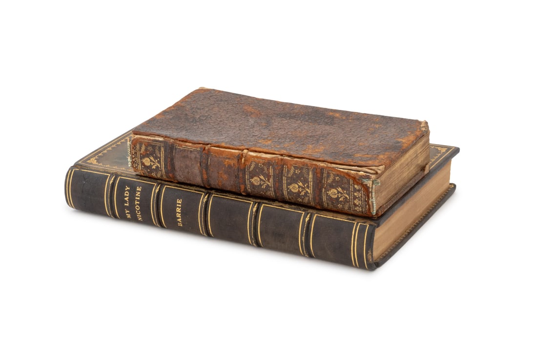 Antique Leather-Bound Book Safe Boxes, 2: Two Antique Leather-Bound Book Safe Boxes, one "Continuation des essais de morale tome treizieme" and one "My Lady Nicotine" gilt-tooled green leather box with marbled paper interior with two compartm