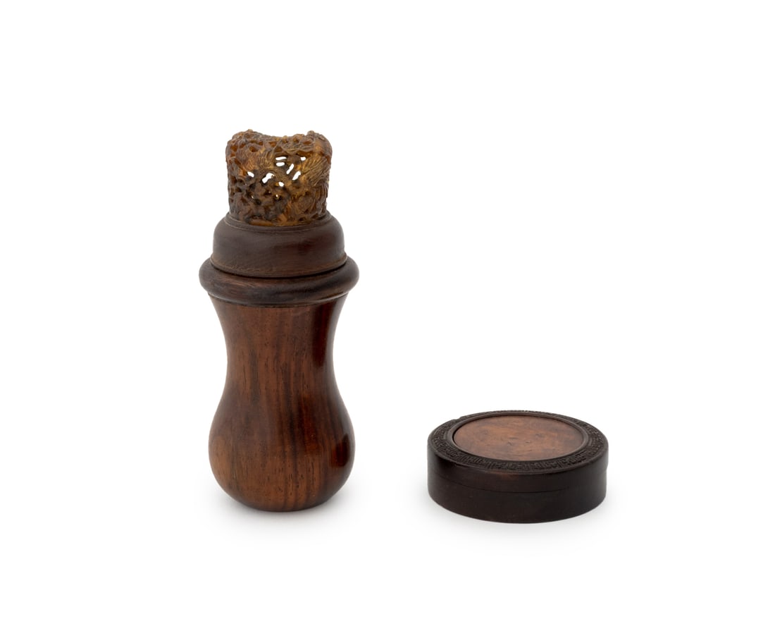 Chinese Carved Wood Boxes, 2: Two Chinese Carved Wood Boxes, comprising: a cricket cage and a small circular covered box with Greek key border encircling a burlwood center. Larger: 4.5" H x 1.75" Diameter. Provenance: From a New Y