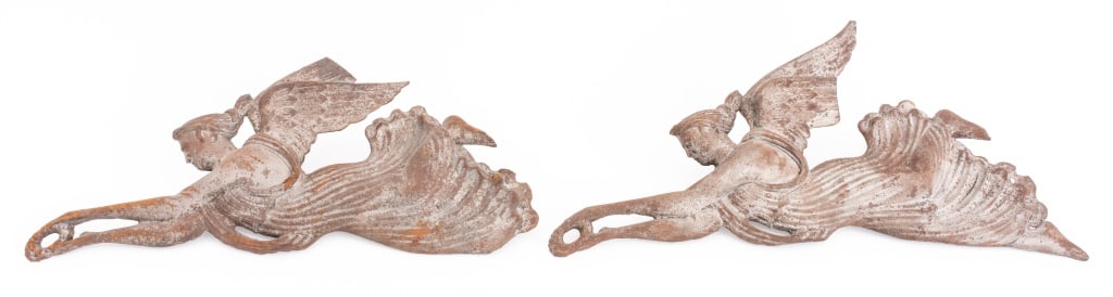 American Folk Art Cast Iron Winged Victories, Pair: Pair of American Folk Art Cast Iron Winged Victory Figures, 19th century, each showing a flying Nike bearing a laurel victory crown aloft. 8" H x 17" L. Provenance: From a New York City Collection. Ke